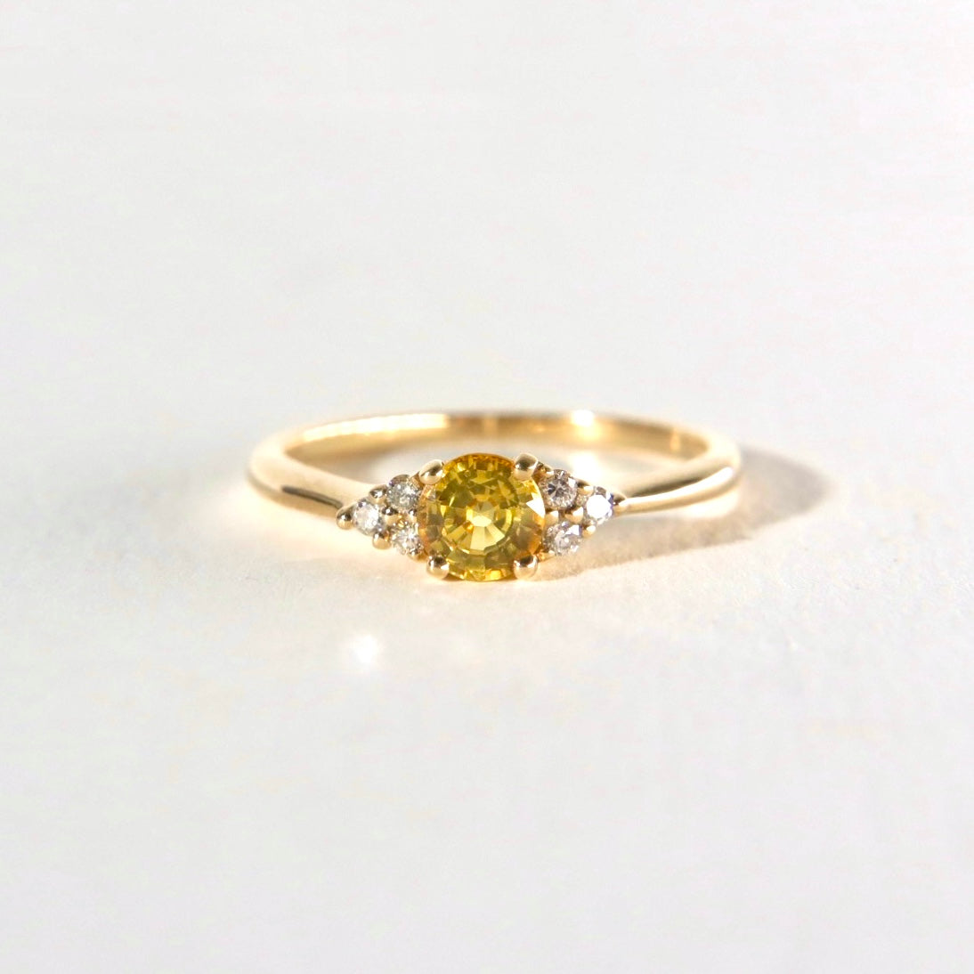 yellow sapphire with a cluster of diamonds