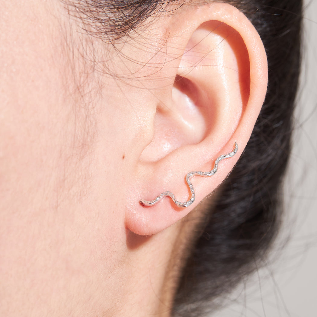 viper the ear climber in 9k white gold on ear